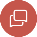 A red circle with two white speech bubbles.